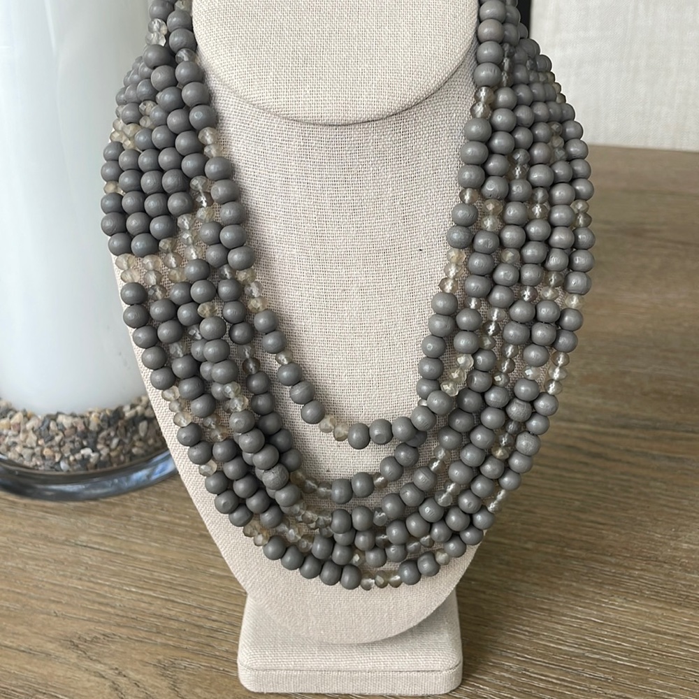Six strand wood bead necklace.